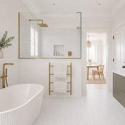Carrara Petite Herringbone Mosaic Tile in a bathroom, shower recess and floor. Reference installation photographed by our supplier.