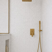 Carrara Petite Herringbone Mosaic Tile in a shower with a recessed niche. Reference installation photographed by our supplier.