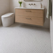 Carrara Round Mosaic Tile as a bathroom floor. Reference installation photographed by our supplier.