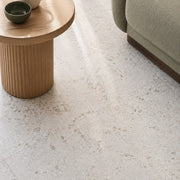 Haven White Terrazzo-Look Tile as a living room floor, close view. Reference installation photographed by our supplier.