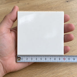 Studio Chalk Subway Tile sample held in a hand.