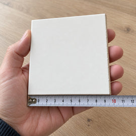 Studio Linen Subway Tile sample held in a hand.